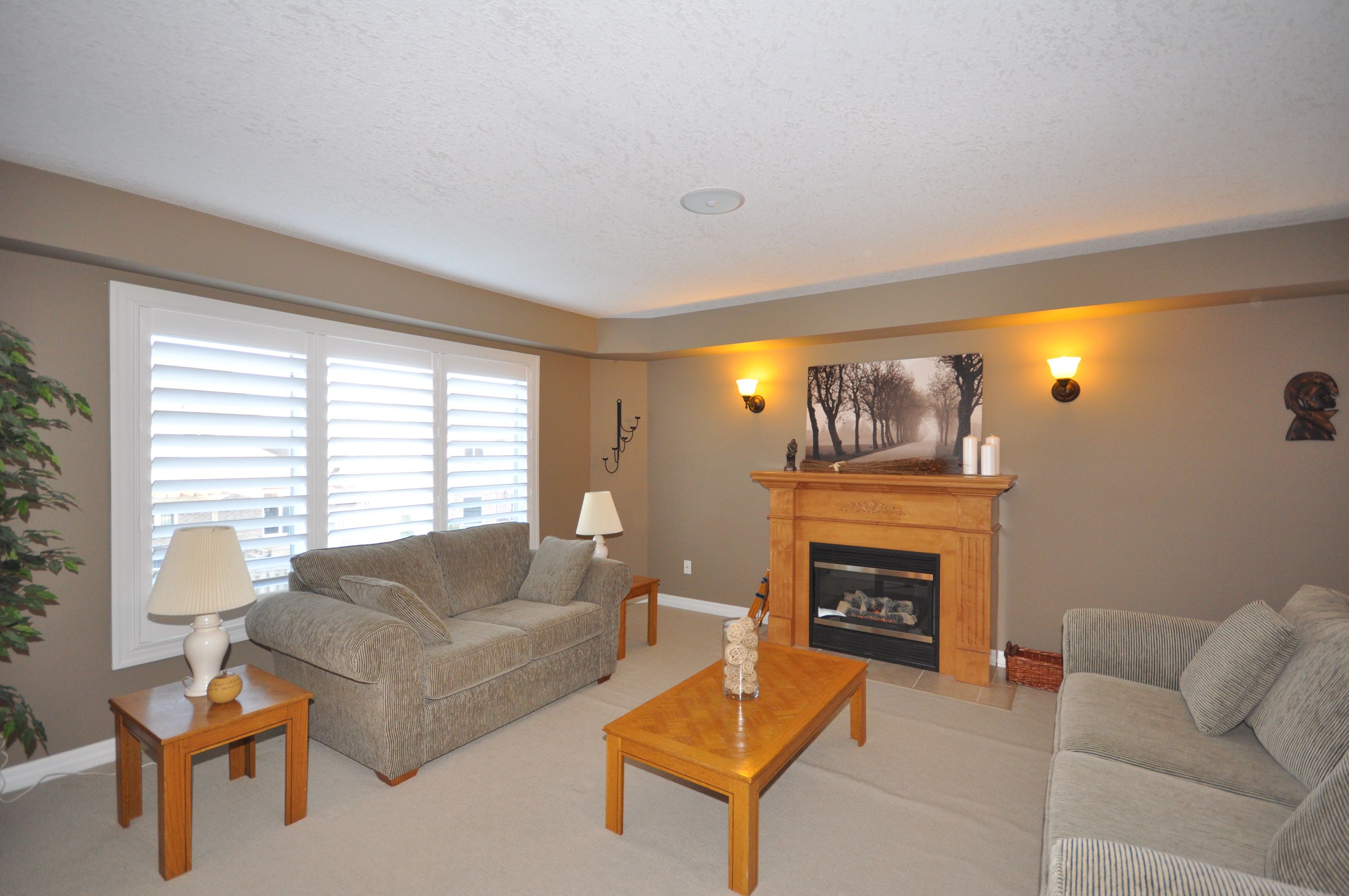 Open concept main floor great room with cozy gas fireplace