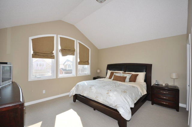 Master Bedroom With Pallidum Windows & Cathedral Ceiling