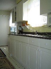 Main floor kitchen with extra cabinetry 