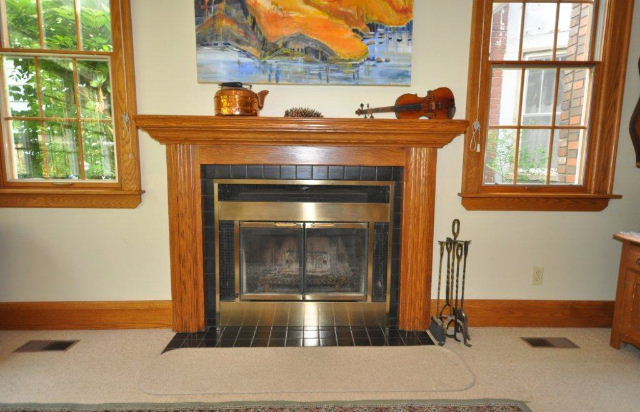 Close up of family room oak fireplace