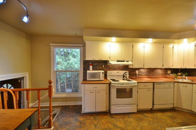 Kitchen with access to side yard sundeck