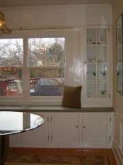 Large window overlooking the backyard and built in glass cupboards to show off your good china and crystal. 