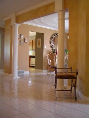 Pillared entry way to formal dining room from foyer 