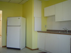 Main floor eat in kitchen with fridge and stove included