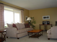 Bright spacious living room with large newer bay window