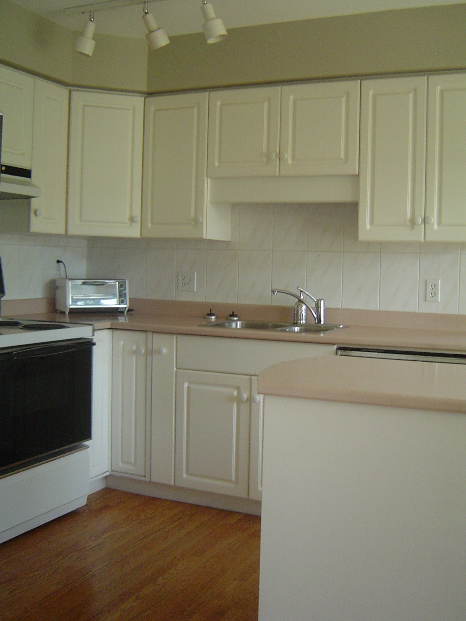 Updated white kitchen wiht hardwood floors